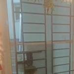 Ganesha light for entrance - Wall mounted lamps for pooja rooms  - Black metal fixture | Beige color | Cylinder shape photo review